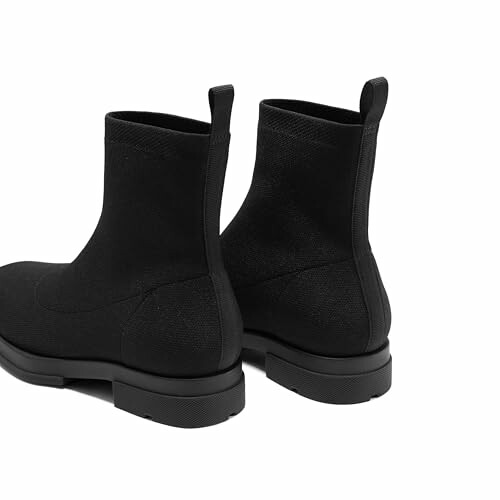 Pair of black ankle boots with pull tabs.