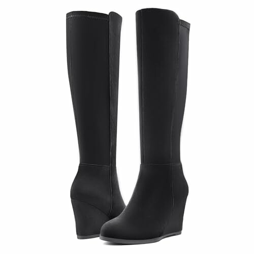 Pair of black knee-high wedge boots