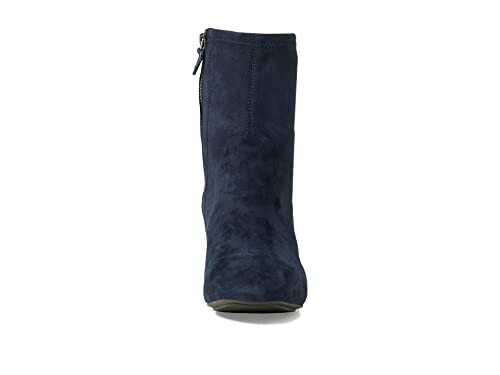 Front view of a navy suede ankle boot with side zipper.